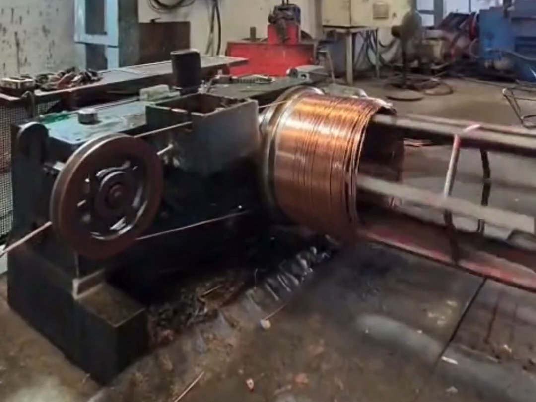 A copper rod coil on the rod breakdown machine at Lahotiraj Metals
